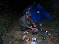 <div class="ru"><p>07.06.2012: Это Дима Антонов, старший инспектор заповедника и опытный водитель болотохода. Когда он был в поле зрения, он всегда шутил. Всегда. </p><p>Ещё это приготовление пищи. Бывало, что ужин мы готовили уже в темноте, а то  и за полночь.</p><p>И ещё это комары, а не густой снегопад в воздухе. Комары на болоте — явление масштабное, так что я про них отдельный пост планирую :).</p></div><div class="en"><p>Jun 07, 2012: This is Dima Antonov, senior inspector of the reserve and seasoned driver of our vehicle. All the time I saw him, he was always joking. Always. </p><p>And, besides, this is our dinner preparing. Sometimes we made supper after sunset, or even after midnight.</p><p>And, moreover, these are mosquitoes, not a dense snow in the air. Mosquitoes on a bog are such a significant phenomenon that I'm planning a special post dedicated to them :).</p><small>polistovsky-expedition</small></div><hr style="clear:both;"><div id="disqus_thread"></div><script type="text/javascript">var disqus_shortname = 'undina-bird'; var disqus_identifier = '1585'; var disqus_url = 'http://undina-bird.ru/Galleries/tabid/56/galleryType/SlideShow/ItemID/1585/Default.aspx';  (function() {var dsq = document.createElement('script'); dsq.type = 'text/javascript'; dsq.async = true; dsq.src = 'http://' + disqus_shortname + '.disqus.com/embed.js'; (document.getElementsByTagName('head')[0] || document.getElementsByTagName('body')[0]).appendChild(dsq); })(); </script><noscript>Please enable JavaScript to view the <a href="http://disqus.com/?ref_noscript">comments powered by Disqus.</a></noscript><a href="http://disqus.com" class="dsq-brlink">blog comments powered by <span class="logo-disqus">Disqus</span></a>